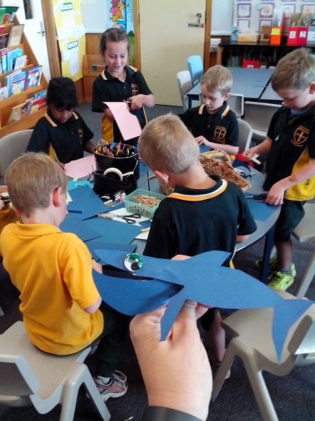 Students making clothespin whales